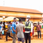 Hon. Mathew Annor, DCE engaging with the people during the National Sanitation Day program at Debiso