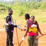 Hon. D.C.E partaking in the National Sanitation Day Programe at Akaatiso